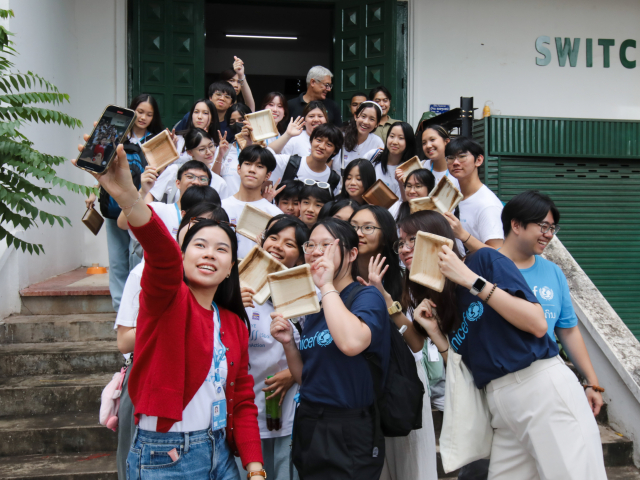 Young people from Laos and Hong Kong take selfies